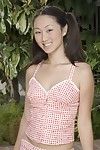 Lewd Asian bimbo Evelyn Lin found a nice place outdoor to demonstrate the shaved pussy