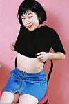 Asian amateur Junko folds back labia lips of hairy cunt after skirt removal