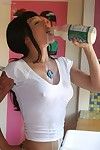 Busty Asian babe Masuimi Max drinks and pours milk on her boobs and strips.