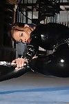 Round assed oiled gal dominant-bitch Susana Spears takes off her black latex outfit in the semi-dark
