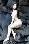 Gorgeous chick Susana Spears has climbed the rocks to spread exposed body as wide as possible