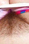 Ripened dame Mel Harper showing off hairy bush in bathtub after bikini removal
