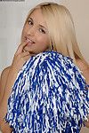 Fair-haired cheer girl Sandy Summers in blue uniform and white panties shows her twat