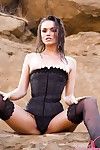 Naughty babe Tori Black in stockings and corset demonstrates her hole in the open air