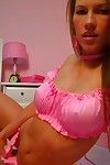 Flirtatious big titted babe in pink Kates Playground poses in her bedroom