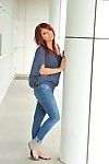 Redhead hottie Madelyn Monroe pulls down her tight jeans to show her ass and smooth pussy