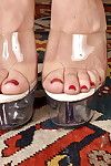 Mature blonde babe Stevie Lix and painted toenails spreading shaved pussy