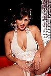 Bosomy brunette Sunny Leone with super sexy curves removes her beautiful dress