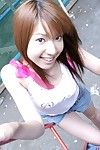 Merry Chinese hotty Yuuna Idols enjoys in teasing and lifting her t-shirt outdoor