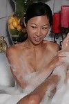 Oriental milf with huge mangos Tia Ling is playing with heavy member in the foamed bathroom