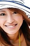 Good-looking charming Yu Saotome covered in extreme hat and blouse is demonstrating her beautiness outdoors and in car