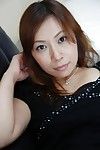 Japanese MILF Machiko Nishizaki undressing and exposing her inviting twat
