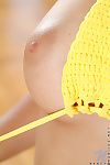 Mettlesome kitty Nancy Nubiles stripping off her blue jean shorts increased by yellow panties